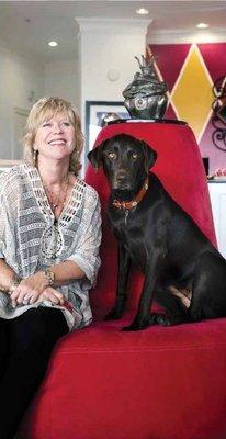 Store owner, Lisa Peters, and her chocolate lab, Gracie Lee.