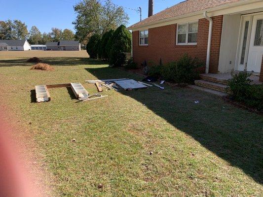 Left the old door and side window with frame in front yard--agreement was to return the next day to clean up--never showed