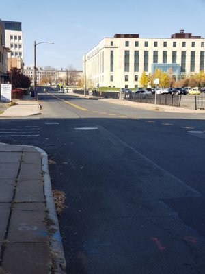 Looking west from the 177-179 Buckingham Street at the restored 1931 state office building with the new 13 story parking garage