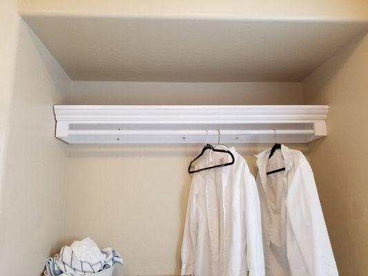 Custom built shelf with clothes rod