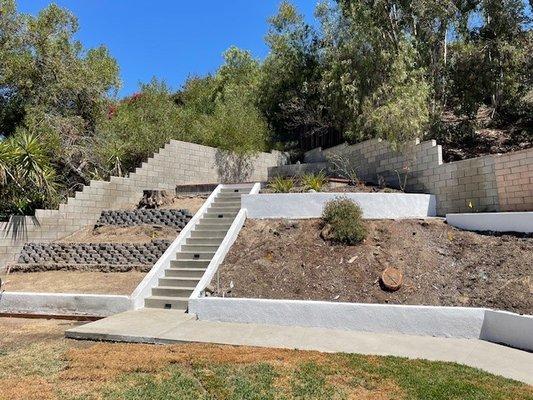 Concrete staircase to hill top patio