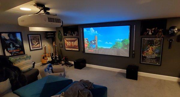 92" Screen Innovations Acoustically Transparent screen coupled with an Epson projector and complemented with dual 12-inch subwoofers.