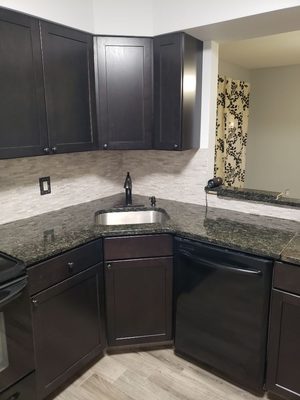 New tile floor cabinets and back spash.