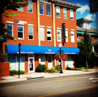 Street view of Manoca's Salon, located on 620 N. Main St., Blacksburg, VA. Entrance behind the building on parking level.