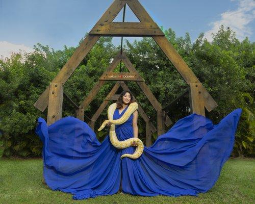 Quinceanera photo session at Secret Garden Miami, wearing a beautiful fancy dress, python snake rental