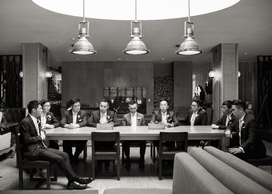 groomsmen rehearse for a surprise a capella performance, at Andaz, Napa