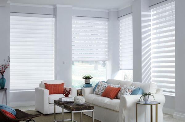 Motorized layered shades in living room.