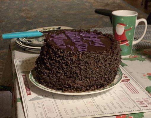 This is a chocolate mouse cake, three layers with mouse between the bottom two layers. Should it slant like the Leaning Tower of Pisa?