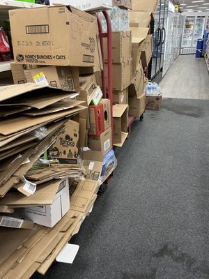 Garbage left out in the open. Not only disgusting to look at but a hazard for all of the older customers that seem stuck here.