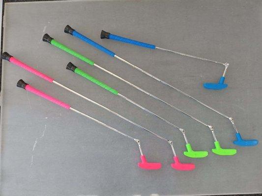 ADA putters for use at The Traveling Bear Indoor Mini Golf location