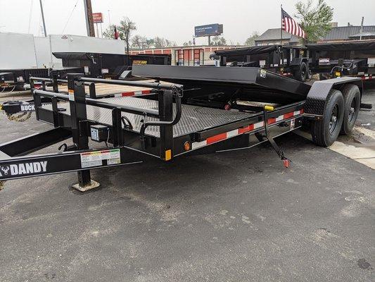 Heavy Duty Tilt Equipment Trailer with 16' Tilt deck and 4' Stationary Steel Treadplate deck. Has variable valve to control rate of descent