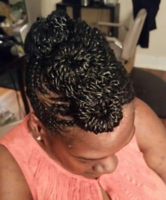 Beautifully crafted cornrow and 2 strand twists combination styled into a fauxhawk!