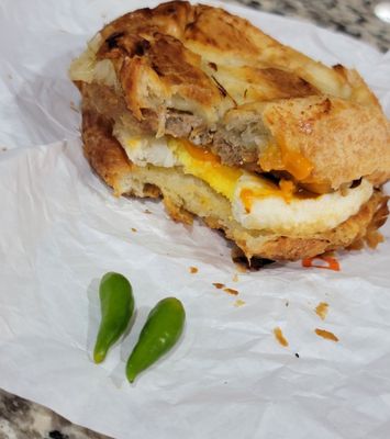 Breakfast sandwich on crossiant with turkey,fried egg n cheese! I added my own spicy mayo and thai chili from my garden, FIRE!