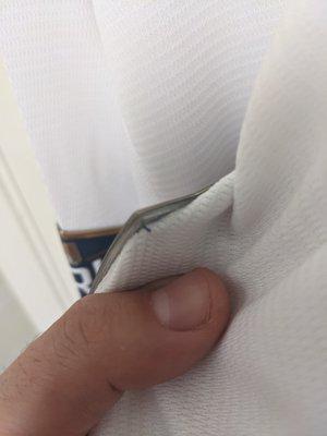 The thread is far enough into the patch that the edges flair up and have already caught on the fabric of the sleeves when putting them on.