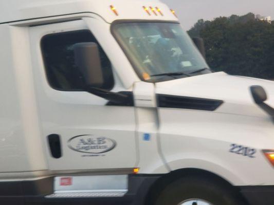 Merged into my truck had to slam on breaks to avoid accident.  Then continued into left lane where semis are not aloud several posted signs.