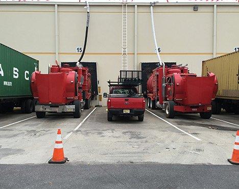 Our trucks can reach 40-stories high. Roof vacuuming services - Adler Industrial Services