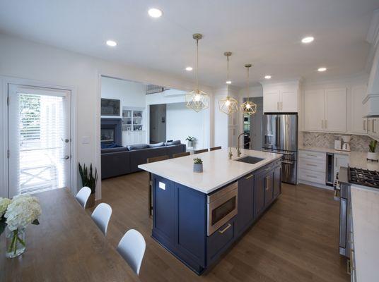 Remodeled kitchen with new center island and larger opening to family room.