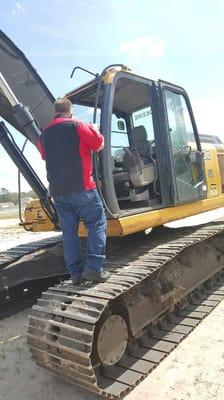 Replacing Windshield on  John Deere Excavator