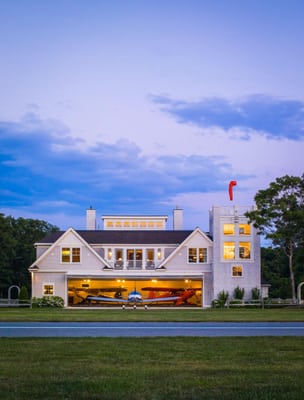 This nationally featured 10,000 s.f. house boasts a ground floor airplane hangar housing four airplanes on a rotating carouse...