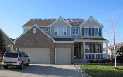 Home has had new shingles loaded, and is ready to have new roof installed.