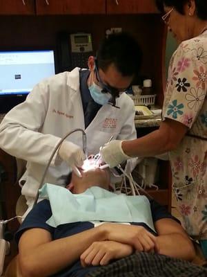 Dr. Bryant Nguyen doing a cavity fill on a patient.