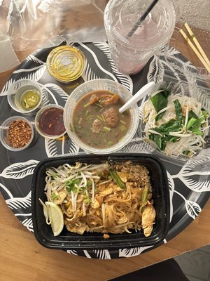 The spread. Chicken pad, Thai, Boat noodle, coconut water with fresh coconut, and lots of chilies.