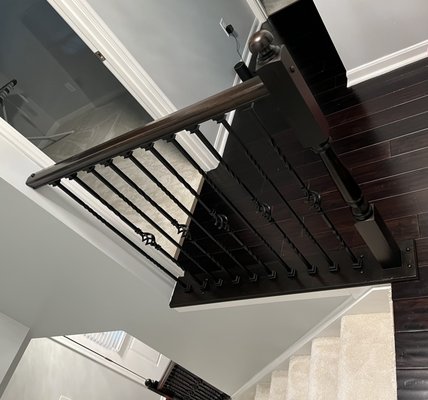 Wrought iron balusters and fresh stain