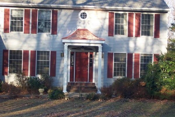 From a plain entrance to a beautiful inviting Portico with copper roof. In Crownsville, MD