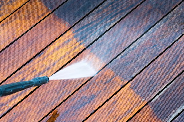 Someone's front deck being power washed.