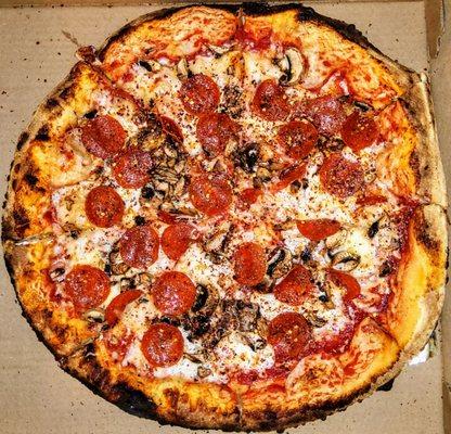 Large pepperoni and mushrooms pizza.