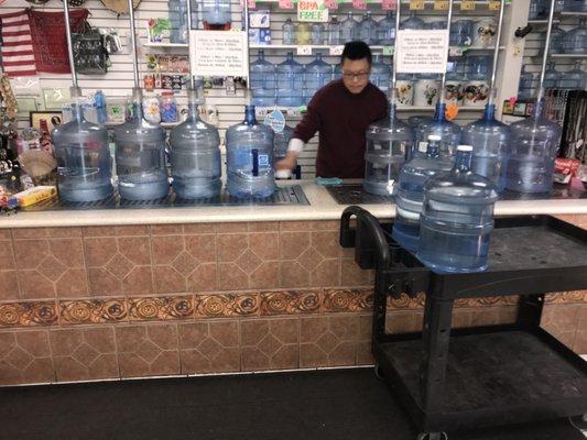 Getting all my 10 water jugs filled up here! So quick and easy!