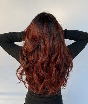 A gorgeous full balayage with a red overlay.