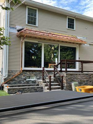 Copper standing seam roof with custom downspout & copper gutter