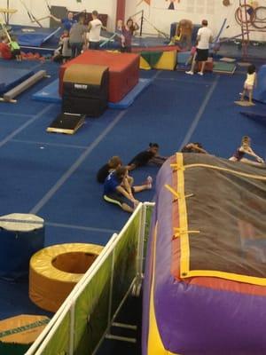 Kids stretching before their gymnastics practice!