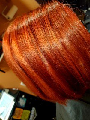 Red on Red hair color is lowlighted & highlighted and glazed with Redken Shades EQ