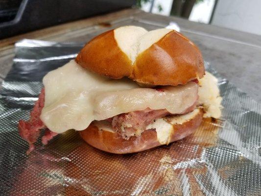 Smoked corned beef and cabbage on toasted Bavarian Pretzel Bun with horseradish mustard and cheese.