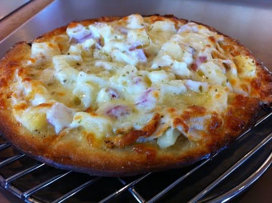 Chicken, onion, and pineapple white pizza