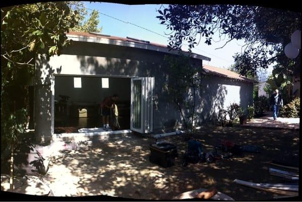 340 sq ft storage addition after. Before smooth coat stucco.  Panoramic doors.  Skylights.  Exposed beam ceiling.