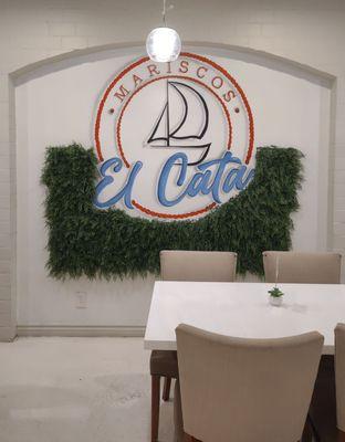 Business logo on a dining room wall