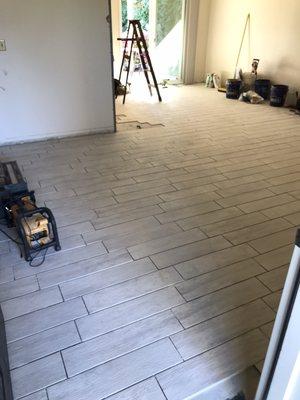 Tile coming along quickly and smooth happy customers