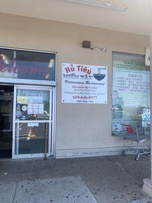 The sign next to the entrance of the supermarket. Go into the super market and you will see the restaurant in the back