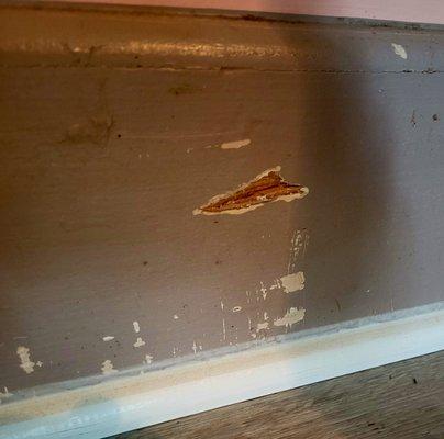 Gouge in kitchen baseboard that happened during floor install