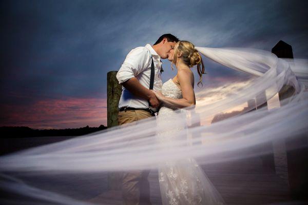 sunset on the pier at Indian Creek Yacht & Country Club photo by Ashley Peterson Photography