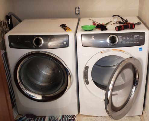 Working on the leaking Electrolux washing machine. Fixed.