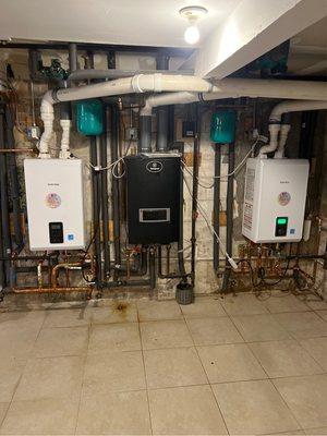 Replacement of 2 old tankless water heaters with 2 new Navien Combi heaters