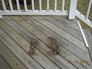 Before 'Gentle Clean' by Spray and Clean.  Paint overspray, and gray decking.