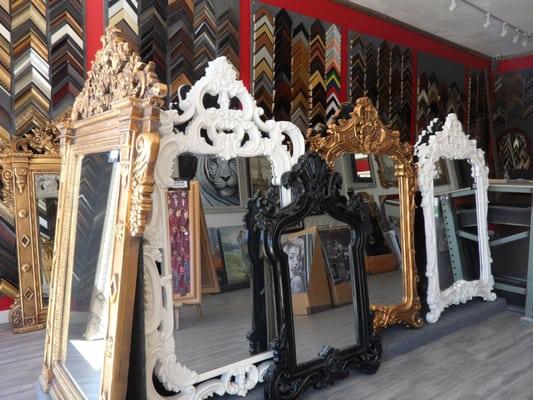 Ornate mirrors in black, white, silver and antique gold frames