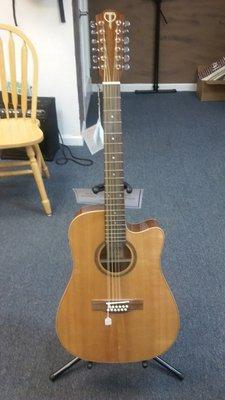 This is the 12-string with a cut-away; the headstock is shown in the other picture.  It's beautiful in every way!!