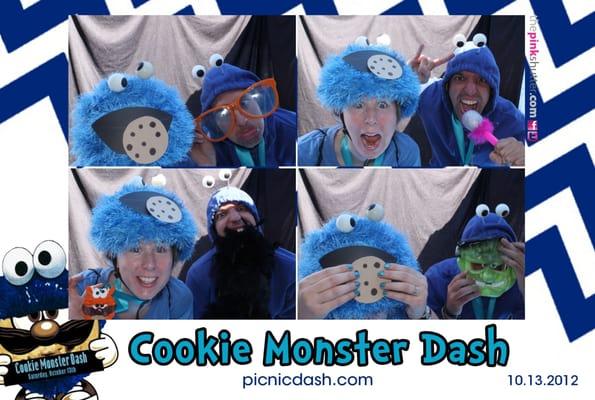 Cookie Monsters take advantage of the photo booth at the Cookie Monster Dash