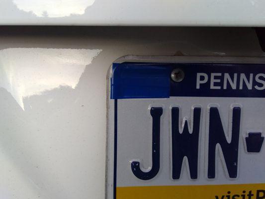 Attempt to hide vehicle registration date with blue tape